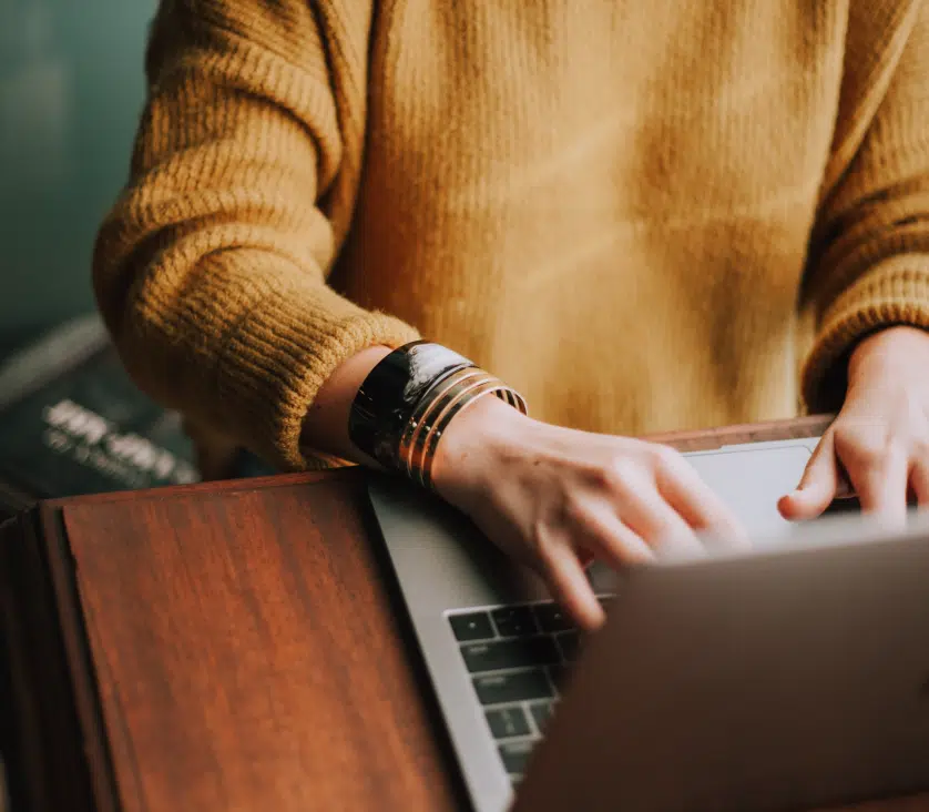 Person typing on laptop