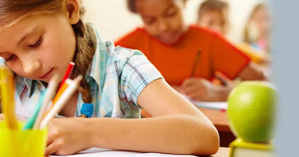 Girl doing exam at school